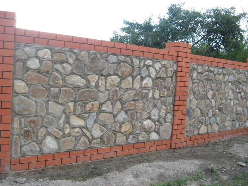 Забор из бутового камня и кирпича